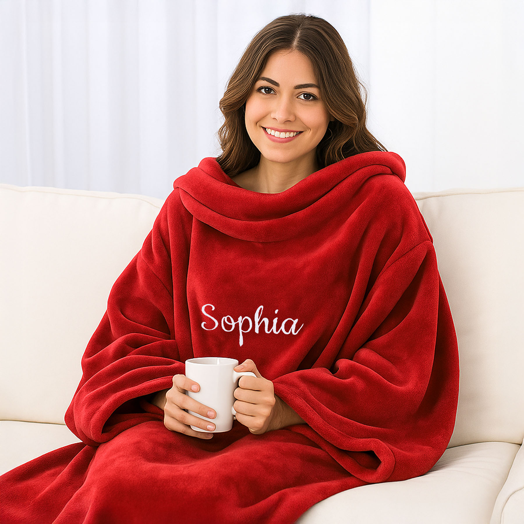 Produktbild von Premium Kuscheldecke mit Ärmeln mit Namen oder Wunschtext bestickt  - Ärmeldecke